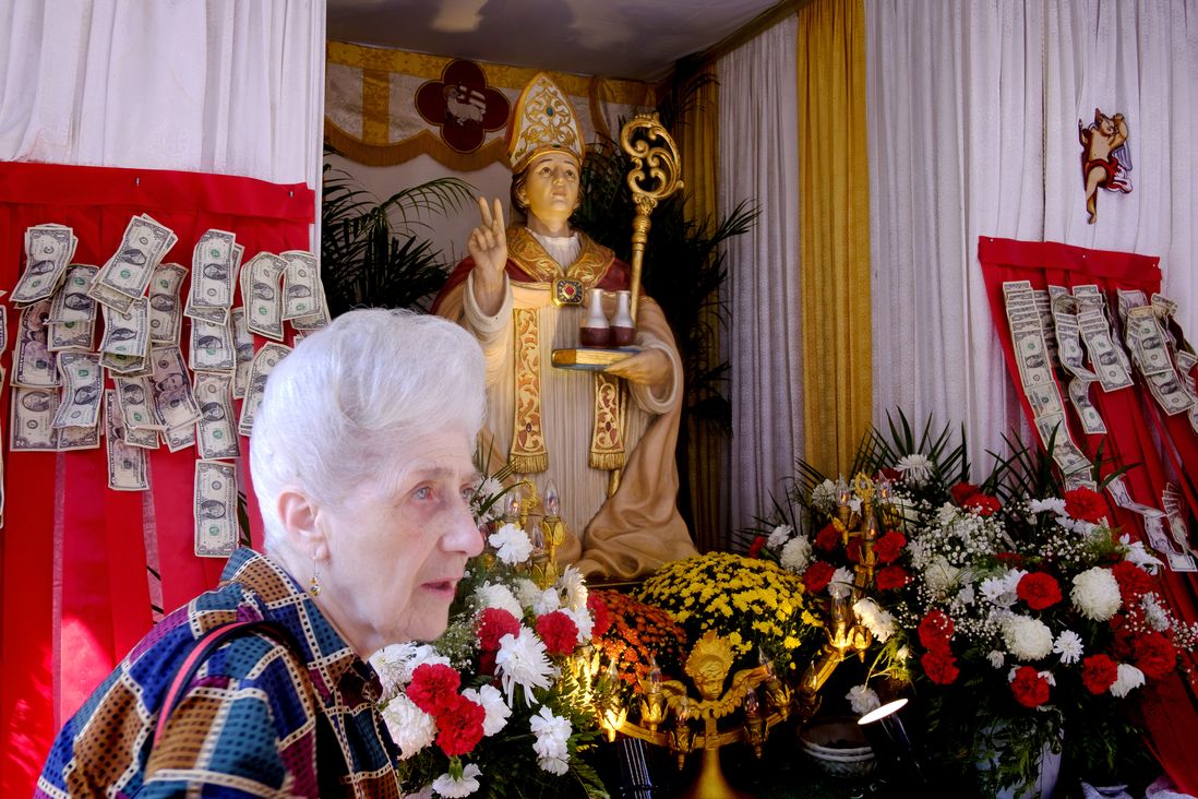 Jeanie Gama, 84, visits the Chapel on Mulberry Street with a statue of San Gennaro. She grew up on the block and although she doesn’t live there anymore she always returns to the festival. The Feast of San Gennaro in the Little Italy neighborhood of Manhattan.